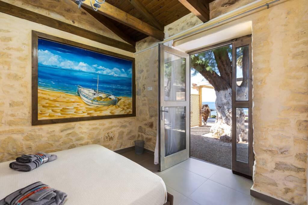 Villa Proto Helidoni - A Cozy Beachfront Villa Petres  Экстерьер фото